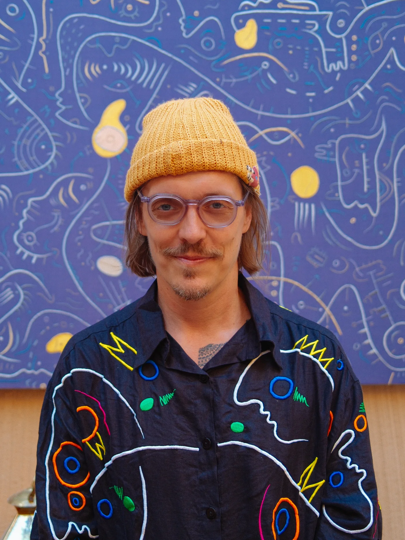 Ole Ukena with an embroidered work at Nômade Temple